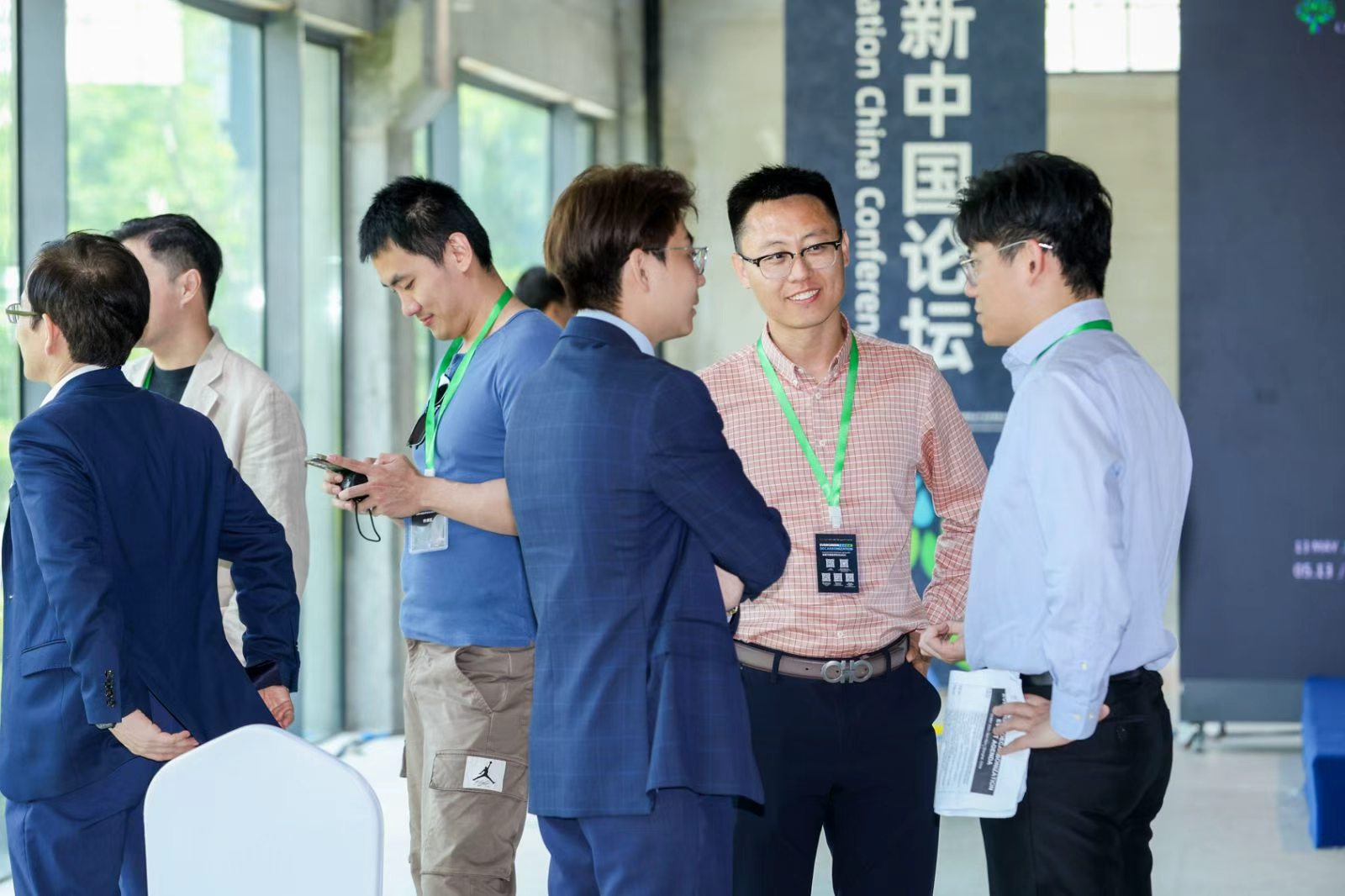 Attendees networking at the conference venue