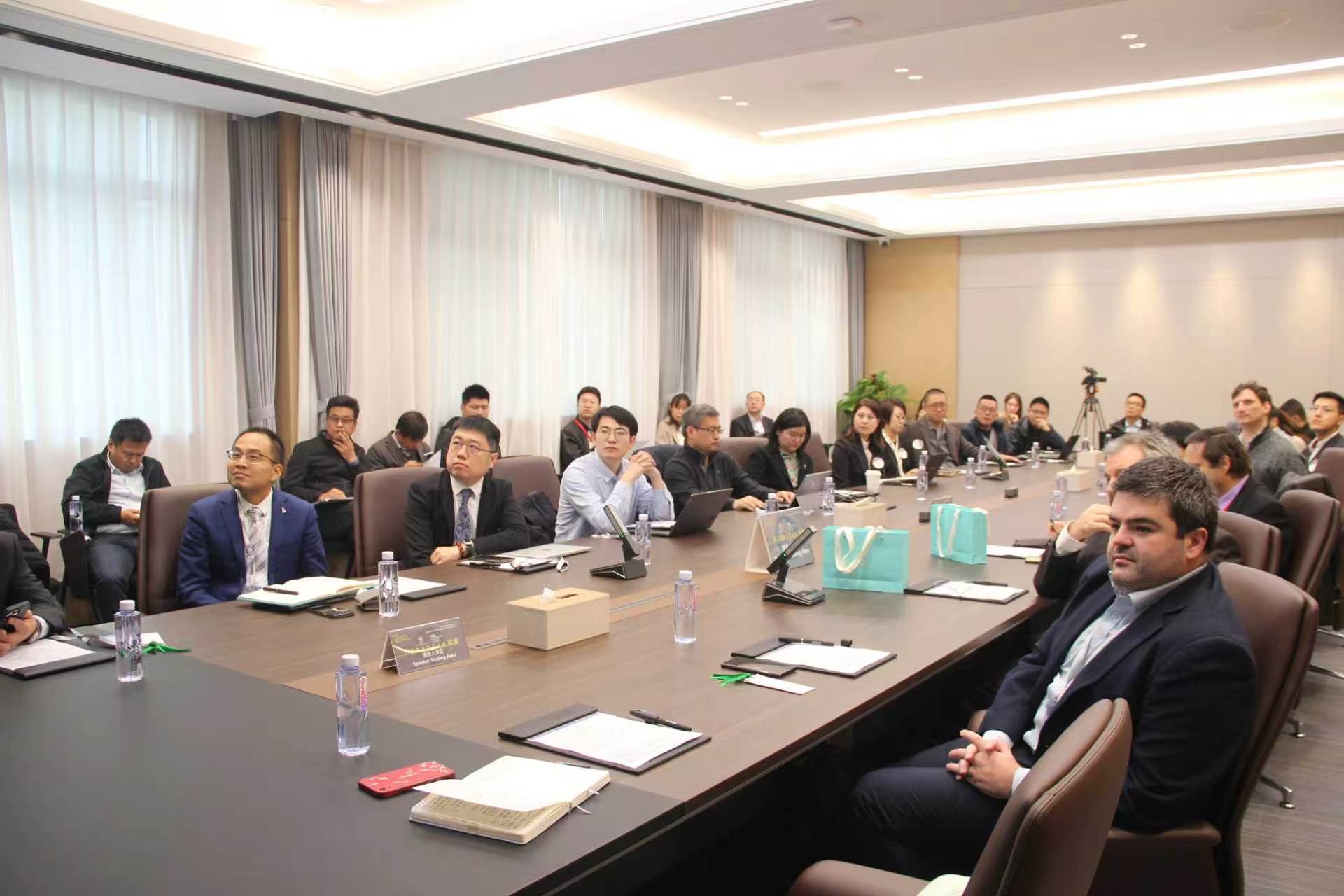 Attendees gathered around a conference table