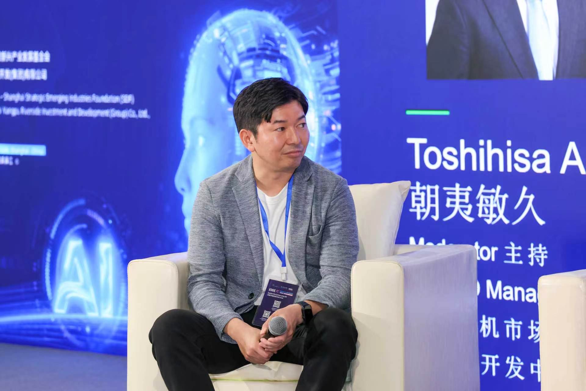 Speaker seated during an Innovation China Conference session