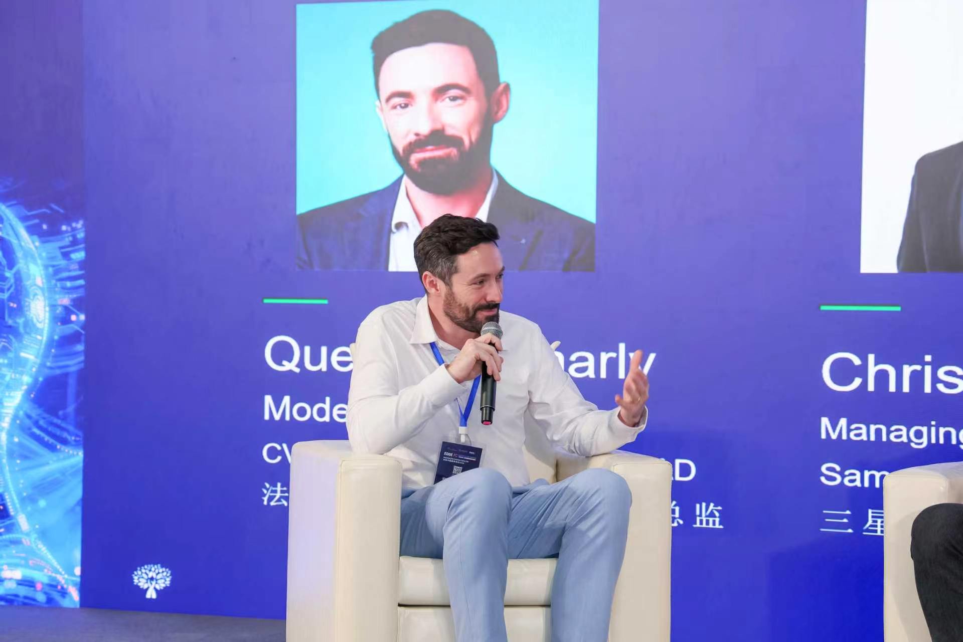Speaker presenting during a conference panel