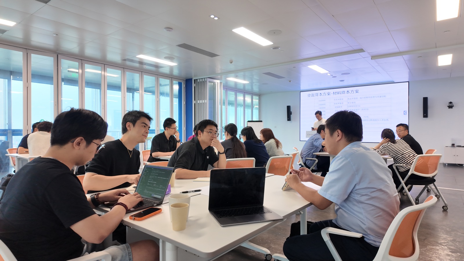 Participants working in groups at CM’s workshop space